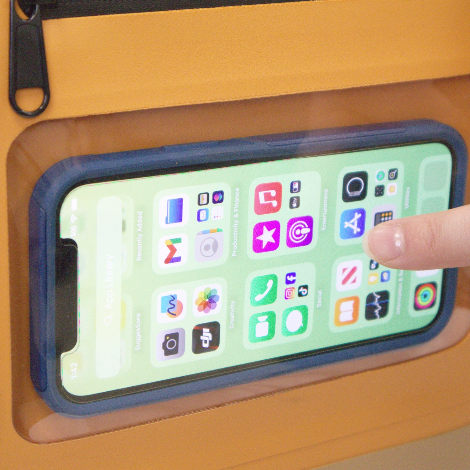 Phone with colorful app icons on a wooden surface