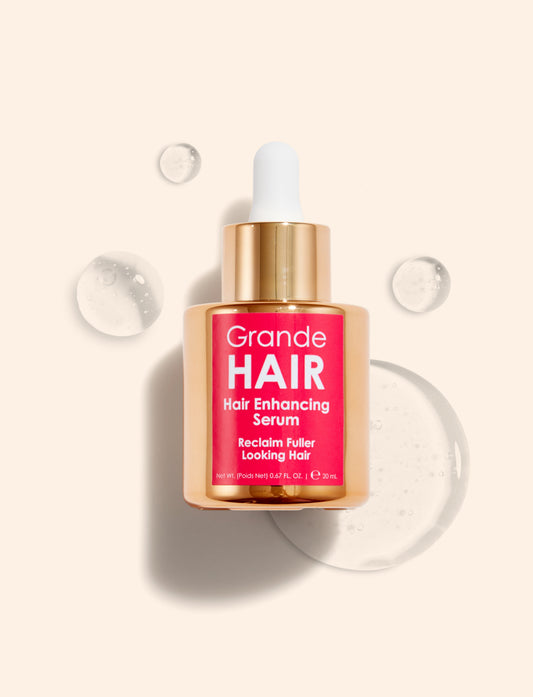 Grande Hair hair enhancing serum bottle with dropper on a light beige background