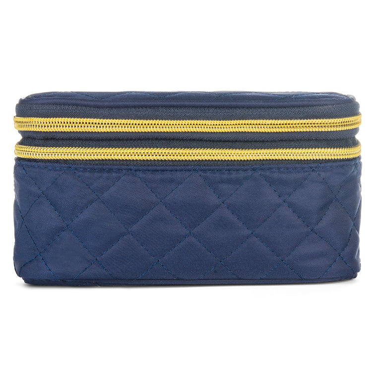 Blue quilted cosmetic bag with gold zipper on a white background