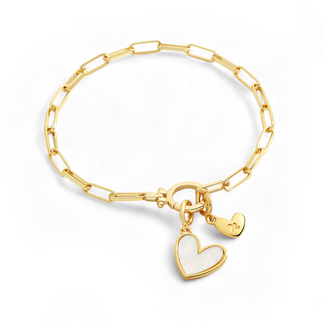 Gold bracelet with heart-shaped charms on a white background