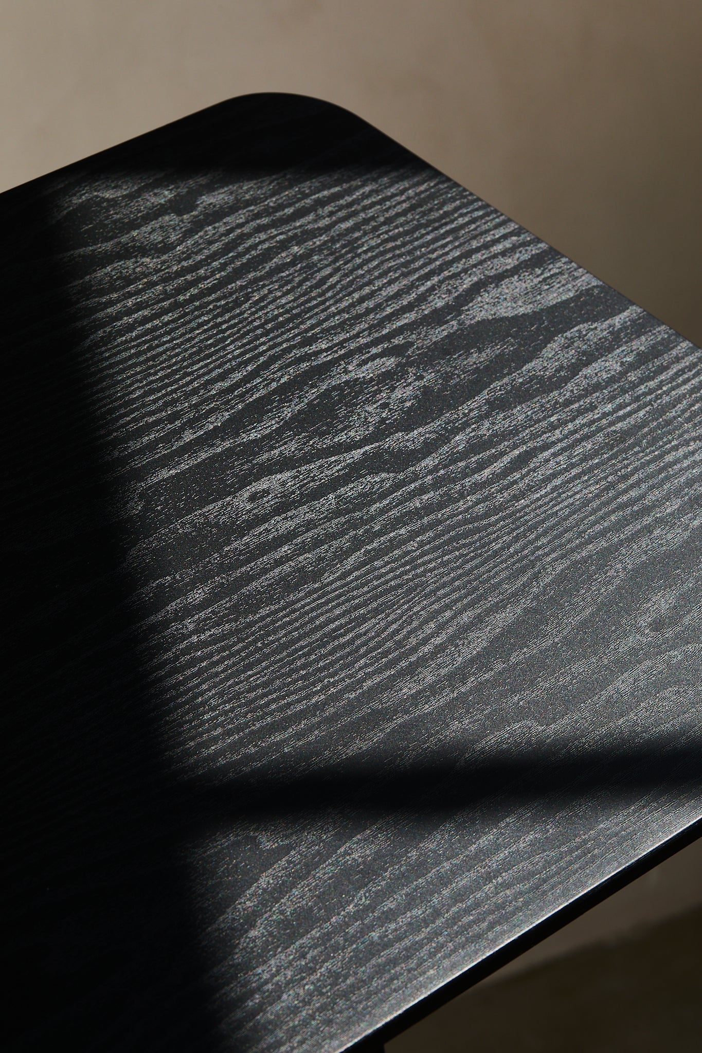 Close-up of a textured black surface with a subtle pattern