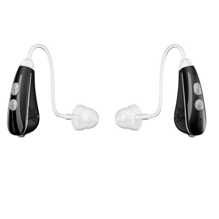 Pair of black and white hearing aids on a white background