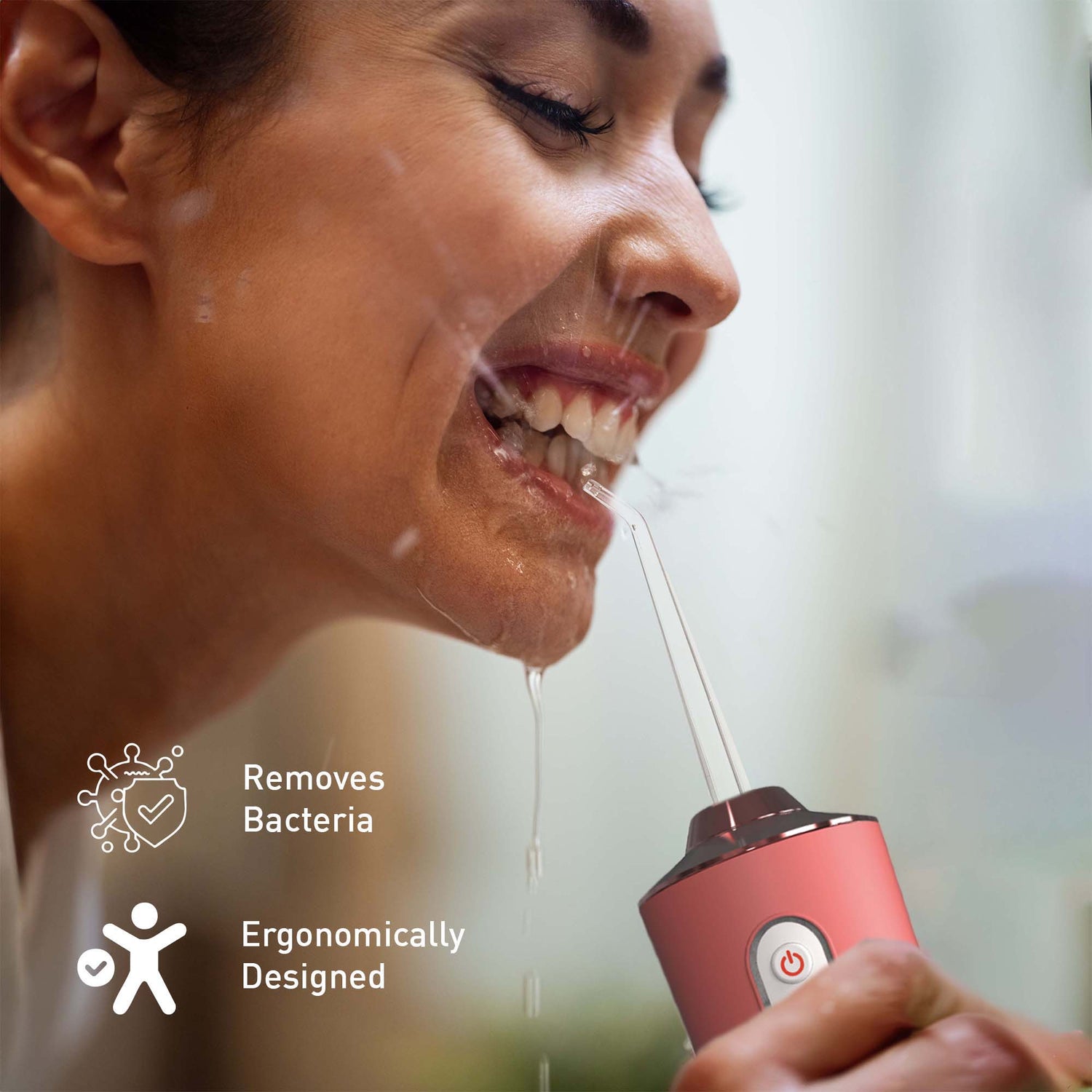 Person using a red dental water flosser with text 'Removes Bacteria' and 'Ergonomically Designed'.