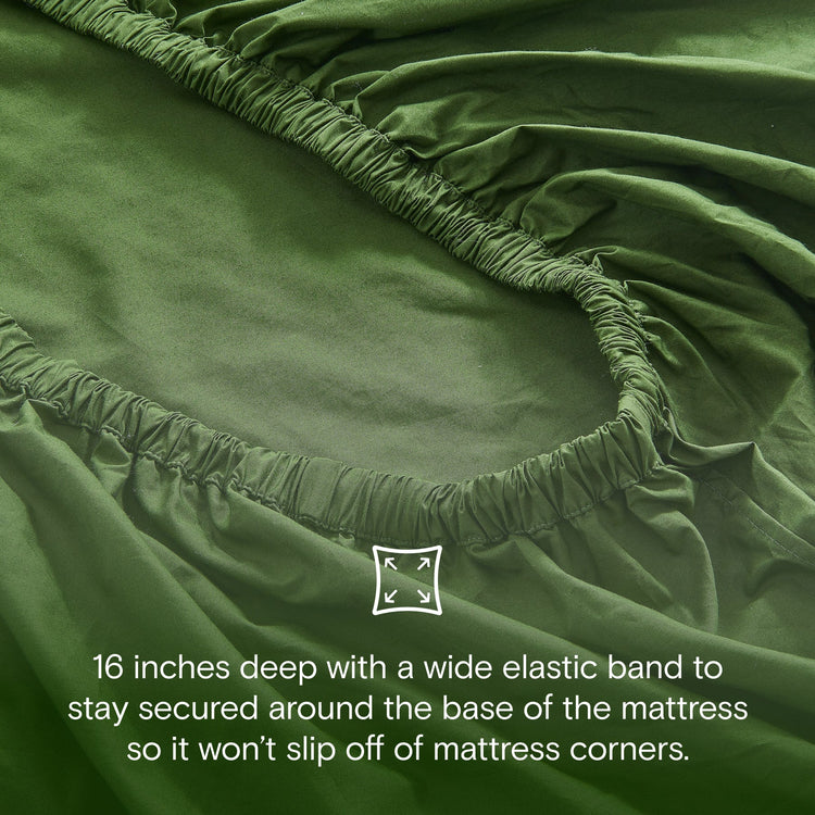 Green fitted sheet with elastic band on mattress