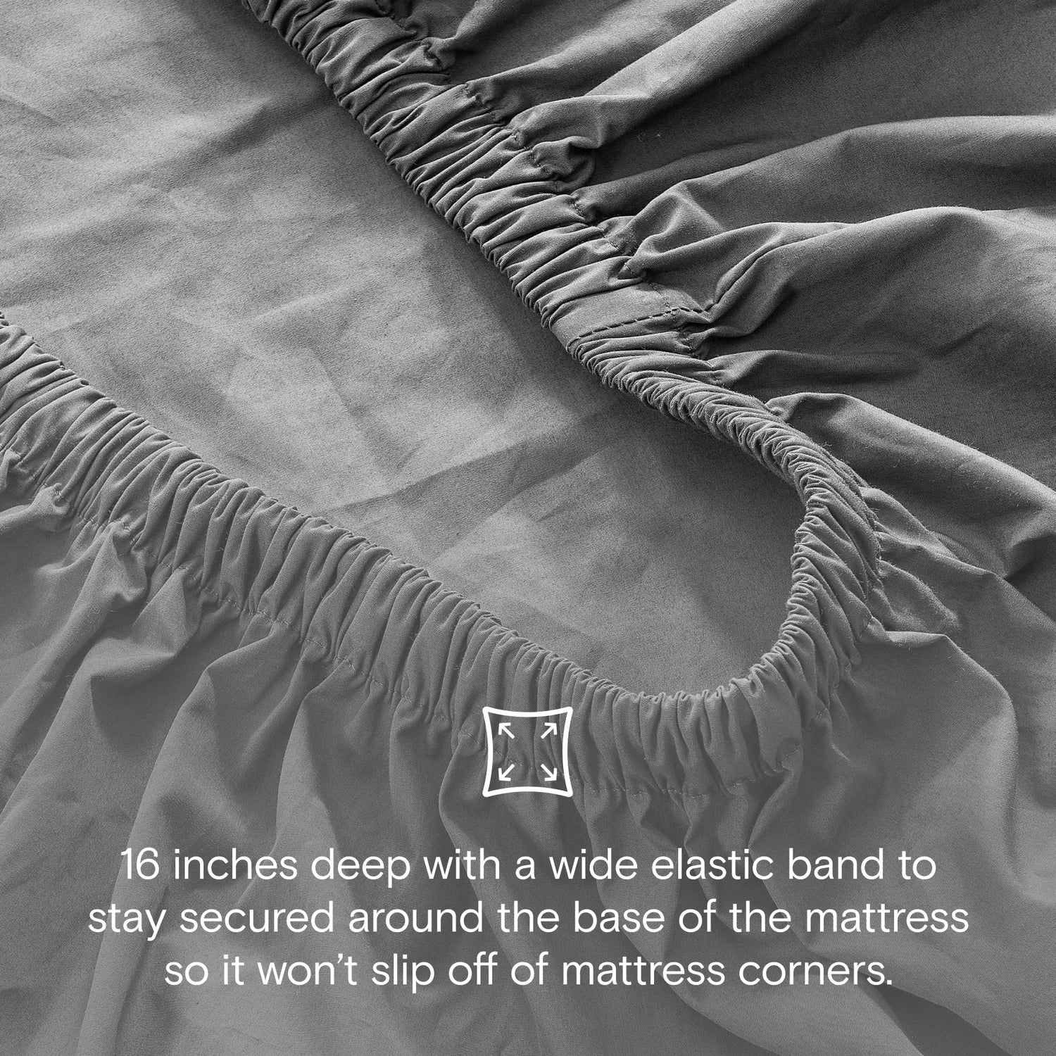 Gray fitted sheet with elastic band on a mattress