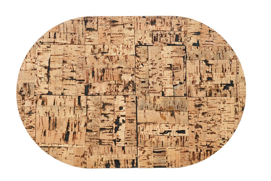 Oval-shaped cork placemat on a white background