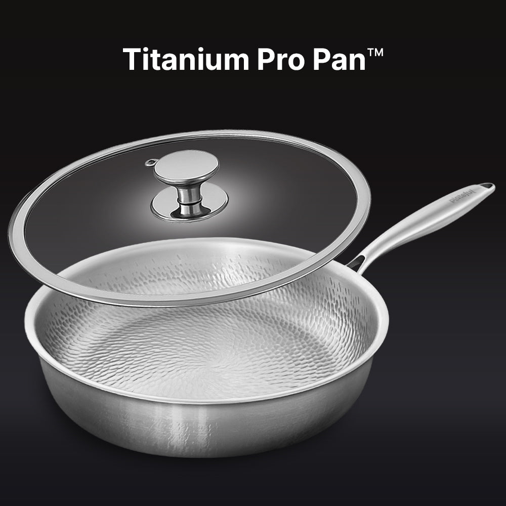 Stainless steel Titanium Pro Pan with lid on a black background