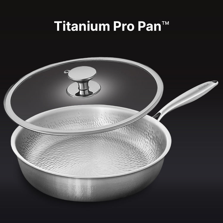 Stainless steel Titanium Pro Pan with lid on a black background