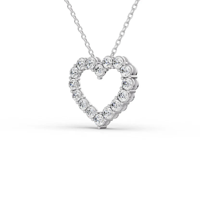 Heart-shaped diamond pendant on a white background