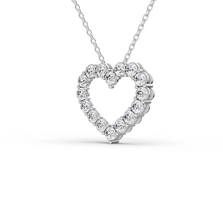 Heart-shaped diamond pendant on a white background