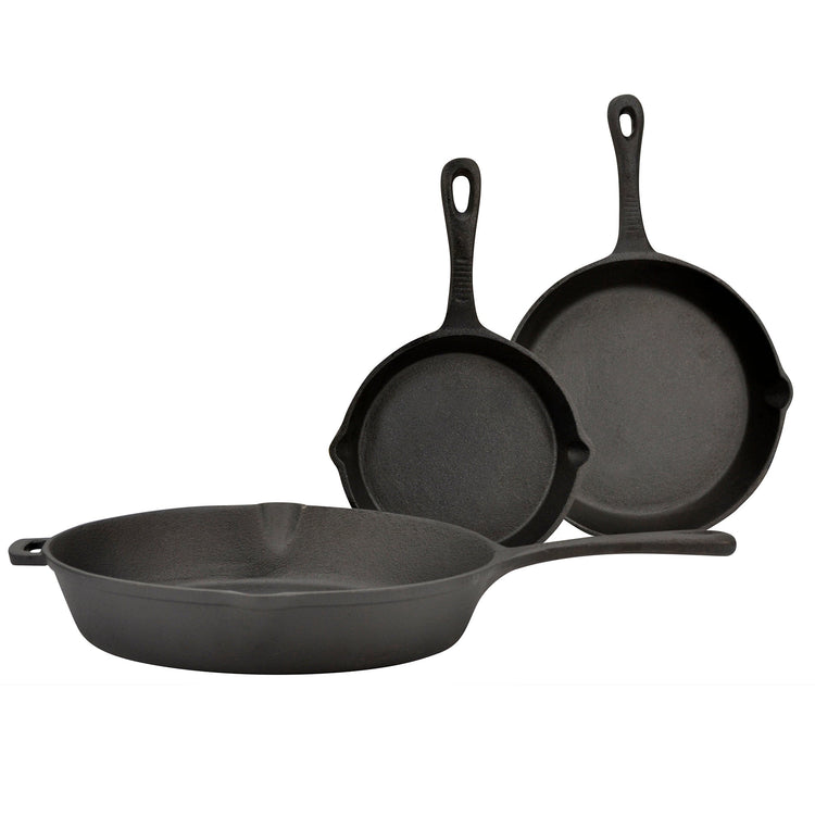 Three black cast iron skillets of different sizes on a white background