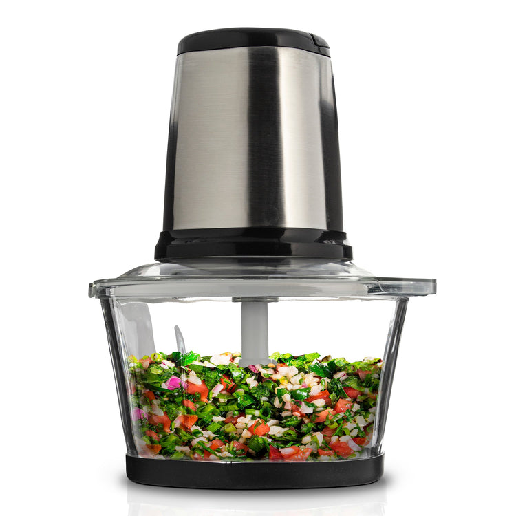 Chopper with chopped vegetables on a white background