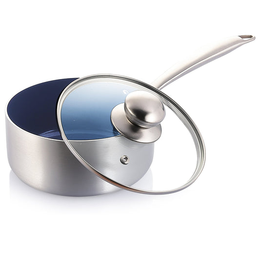 Stainless steel saucepan with glass lid on a white background