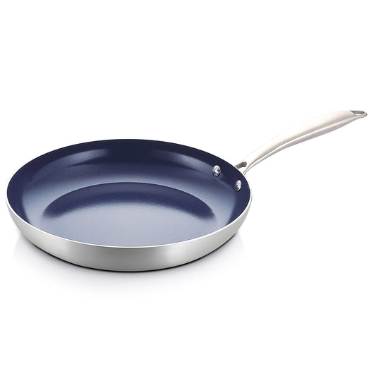 Stainless steel frying pan with a blue non-stick coating on a white background