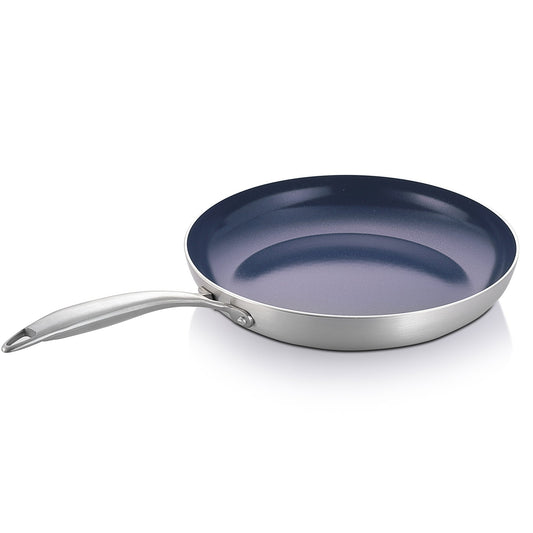 Stainless steel frying pan with a blue non-stick coating on a white background