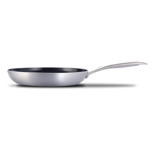 Stainless steel frying pan with a blue non-stick coating on a white background