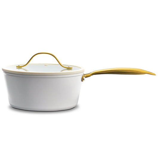 White ceramic pot with gold handle on a white background