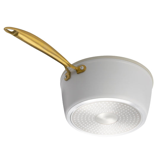 White ceramic pot with gold handle on a white background