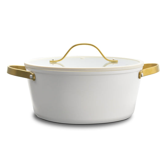 White ceramic pot with gold handles on a white background