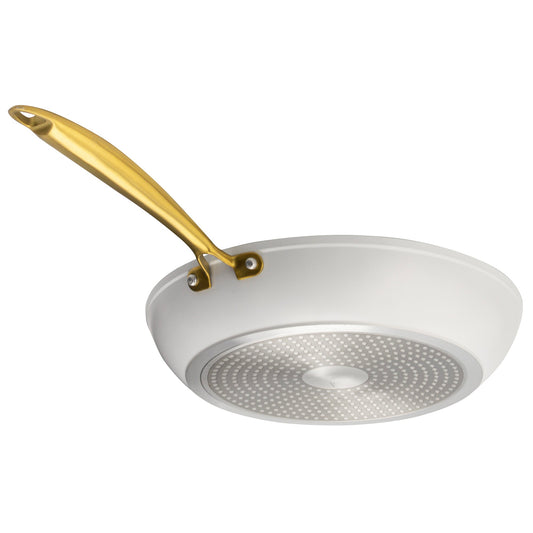 White wok with a gold handle on a white background