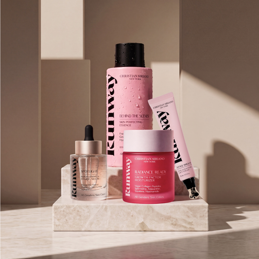 Set of skincare products on a marble surface with a neutral background