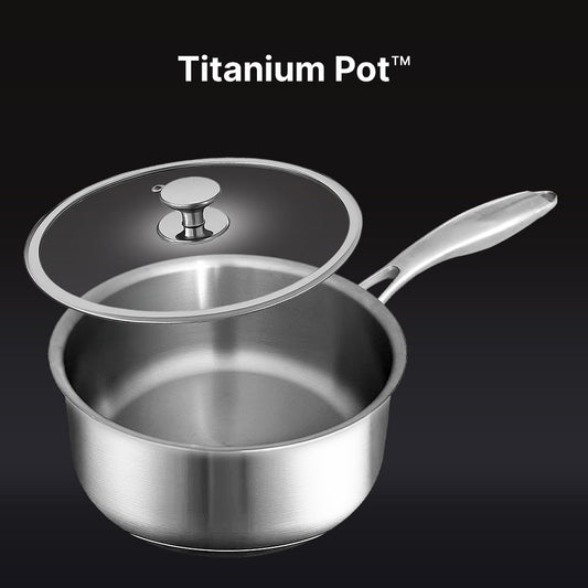 Set of stainless steel cookware including a frying pan, saucepan, and two smaller pots on a white background.