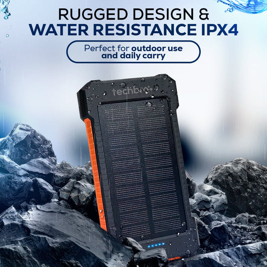 Techbro solar power bank with flashlight on a rocky surface