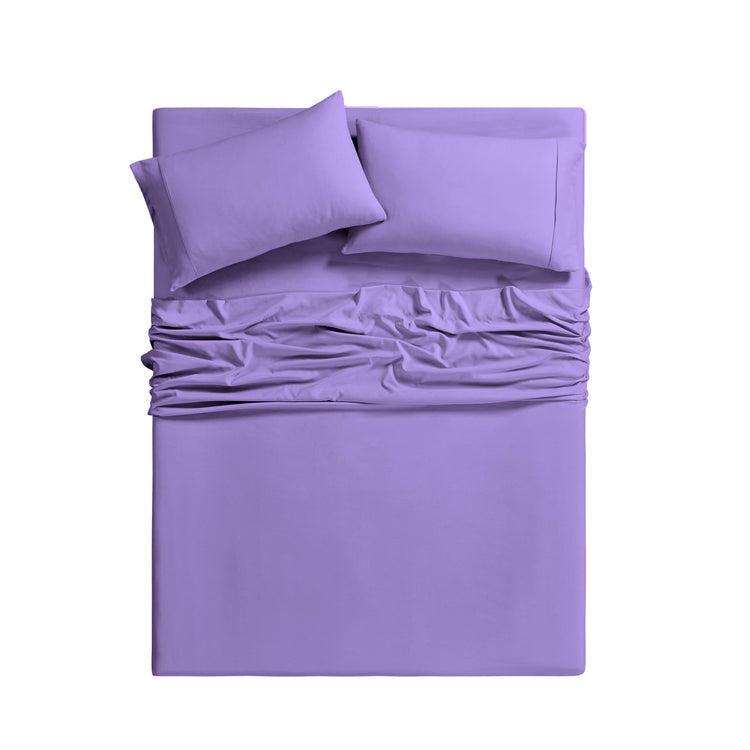 Purple bedding set with fitted sheet and two pillows on a white background