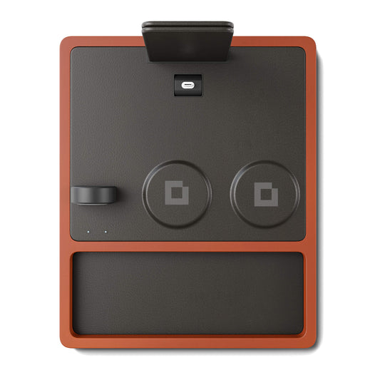 A 4-in-1 MagSafe oak wireless charger with a black and brown color scheme, featuring a section for charging an Apple Watch, a smartphone, and additional wireless charging pads.