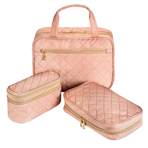 Set of three pink quilted travel bags with gold zippers on a white background