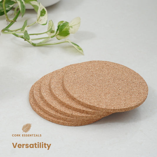 Cork coasters with a mug and flower on a light background, featuring Cork Essentials branding.