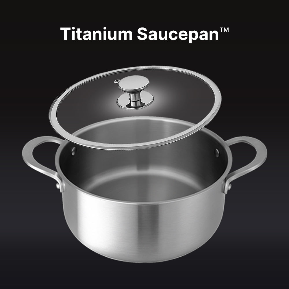 Titanium saucepan with lid on a black background