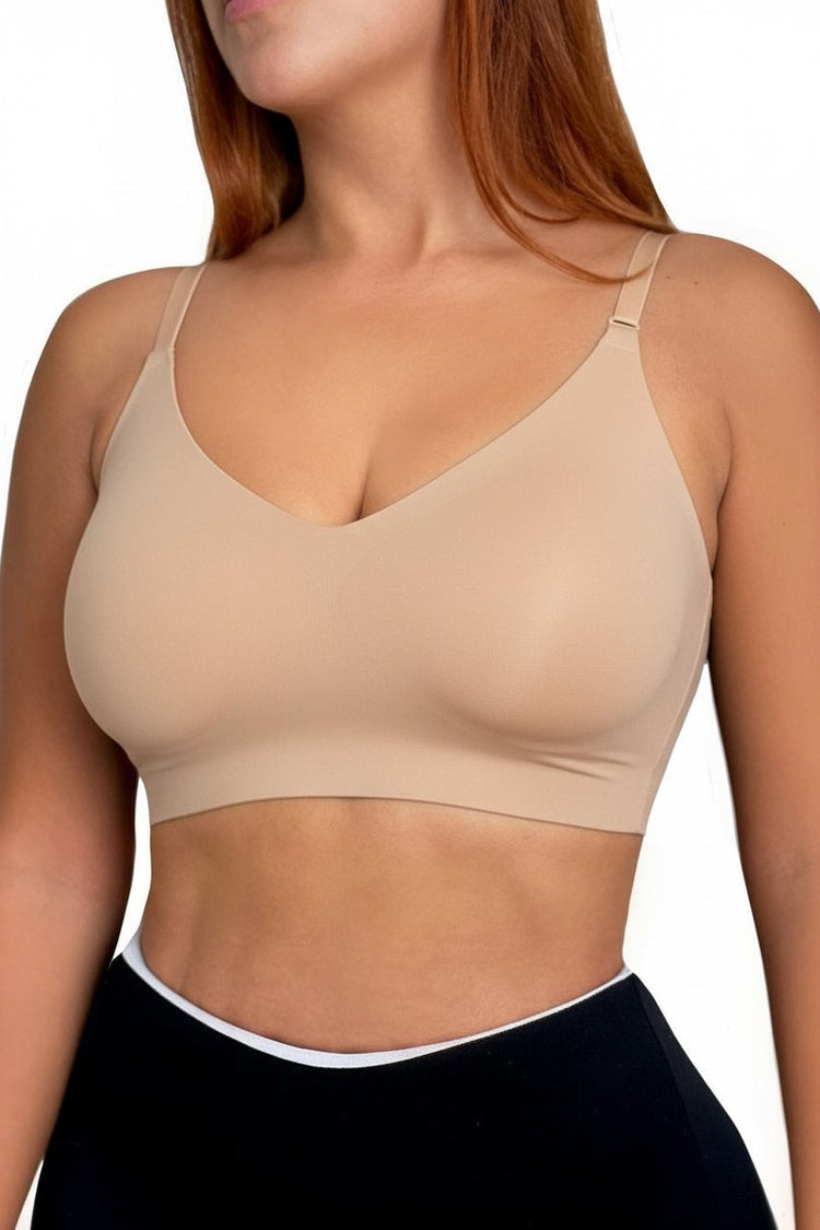 Beige sports bra worn by a person on a white background