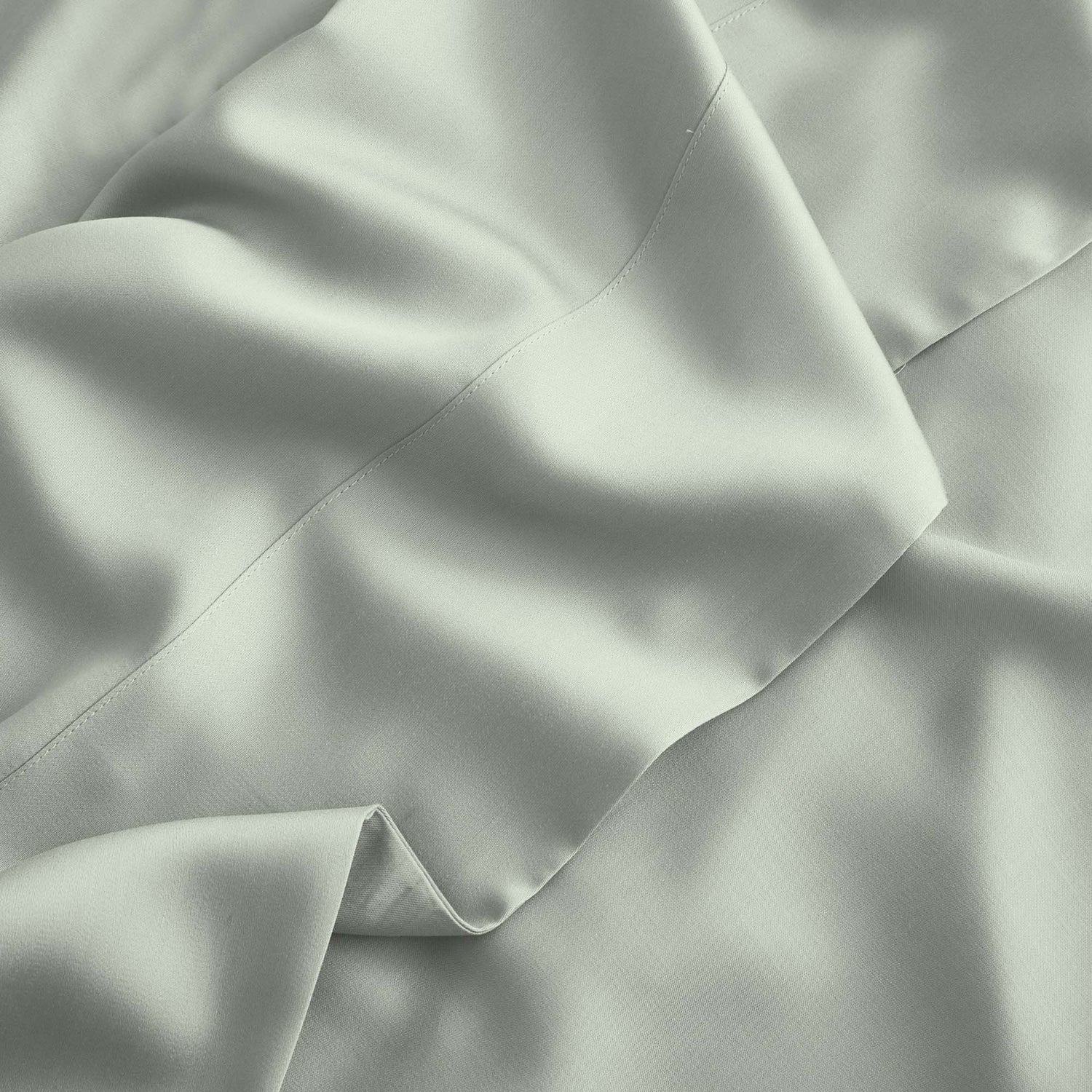 Close-up of light gray fabric with folds
