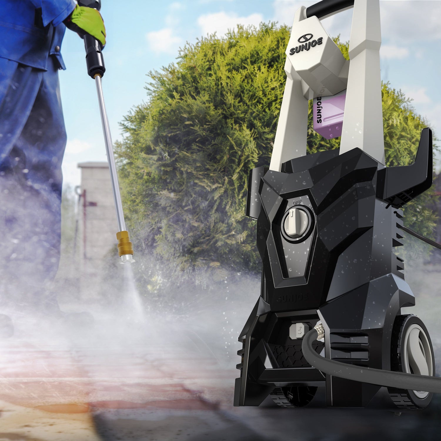 Person using a pressure washer to clean a driveway with a tree in the background