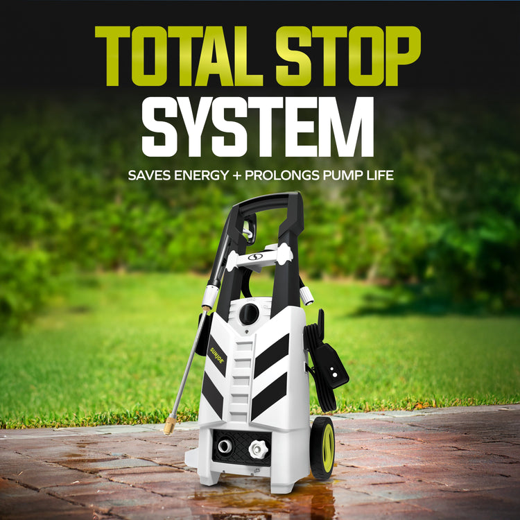Pressure washer with 'Total Stop System' text on a grassy background