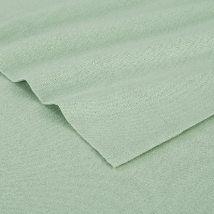 Close-up of light green fabric with a slight texture