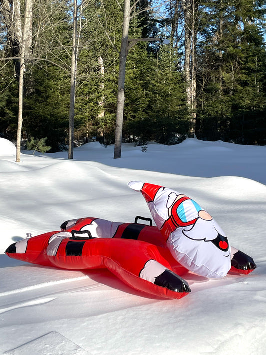 Inflatable Santa Claus figure with goggles on a white background
