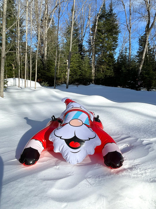 Inflatable Santa Claus figure with goggles on a white background