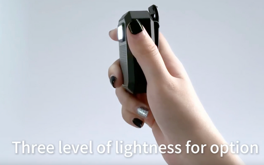 Portable flashlight with textured surface and visible brand name on a gray background