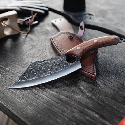 Behold the elegance of the Hakai Cleaver Knife from Seido Knives, with its wooden handle, poised on a cutting board. 