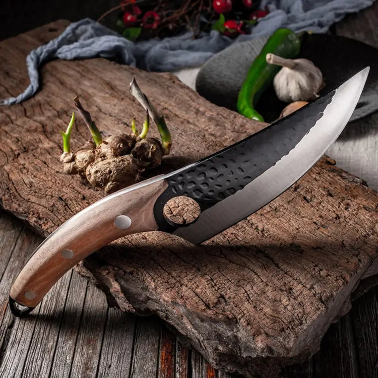 A picture of a cutting board with a Kyodai Utility Chef Knife from Seido Knives, surrounded by mushrooms.