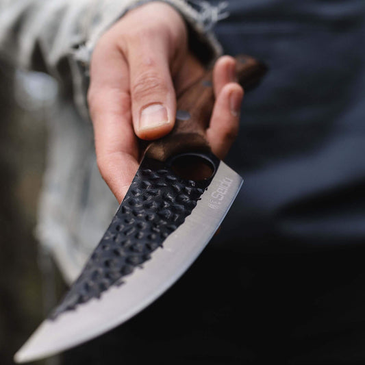 A Kyodai Utility Chef Knife and fresh mushrooms on a cutting board, ready for a delicious culinary adventure!