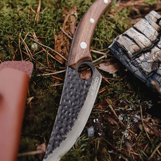 A Kyodai Utility Chef Knife and fresh mushrooms on a cutting board, ready for a delicious culinary adventure!