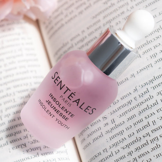 Sentéales skincare product with flowers in the background