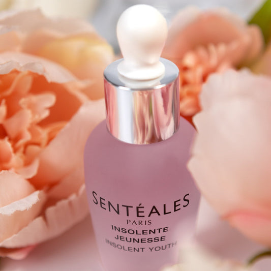 Sentéales skincare product with flowers in the background