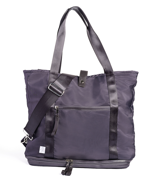 Purple tote bag with black straps on a white background