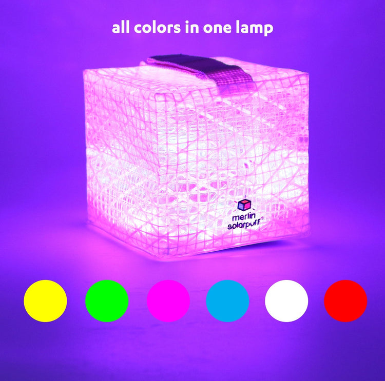 Cube-shaped lamp with Merlin Solarpower logo, emitting purple light, and color options displayed below.