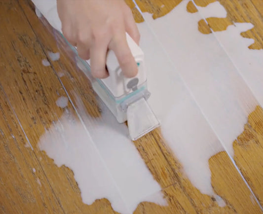 Cleaning tool with attachments on a white background