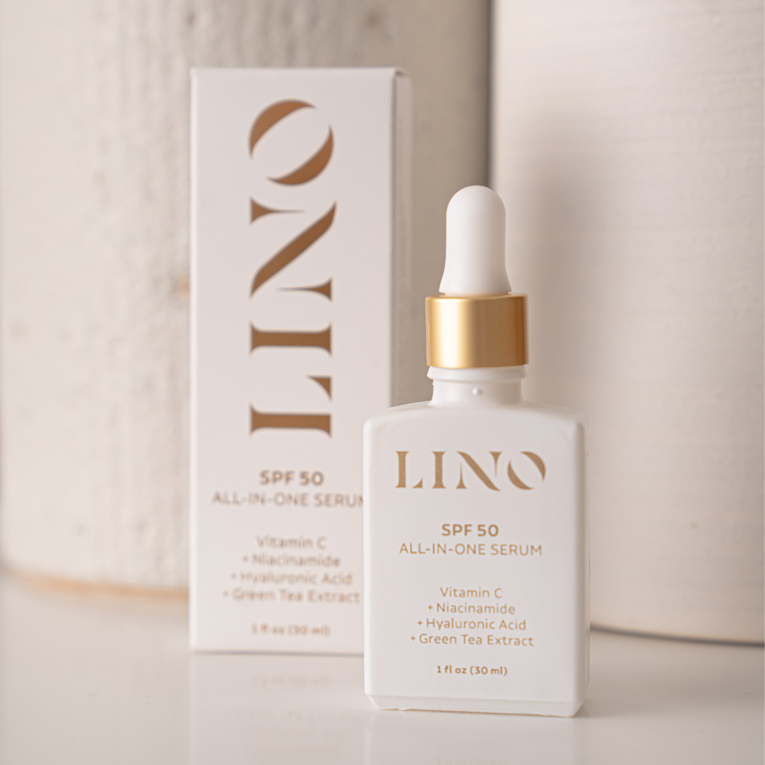 LINO SPF 50 All-in-One Serum bottle and packaging on a neutral background